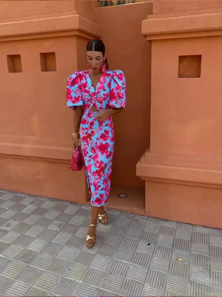 Vibrant printed maxi dress for women, ideal as a wedding guest or cocktail dress, featuring a stylish ruched waist.