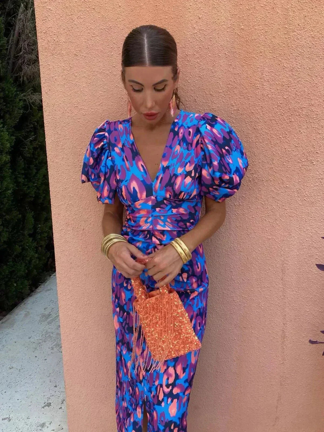 Stylish women's printed maxi dress, a chic wedding guest or special occasion outfit, with flattering ruched waist.