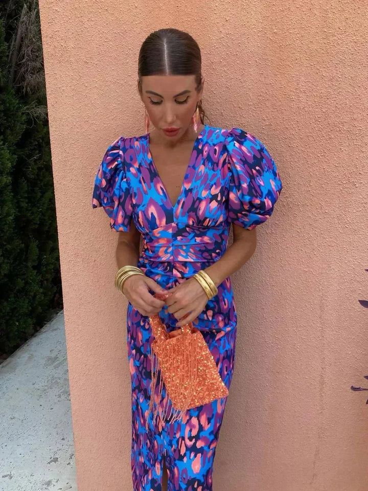 Stylish women's printed maxi dress, a chic wedding guest or special occasion outfit, with flattering ruched waist.