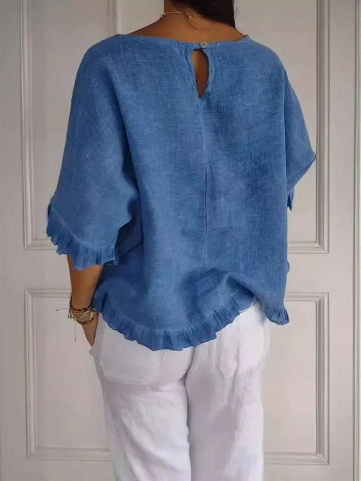 Effortless style with this women's ruffle blouse. Comfortable and chic for any season.