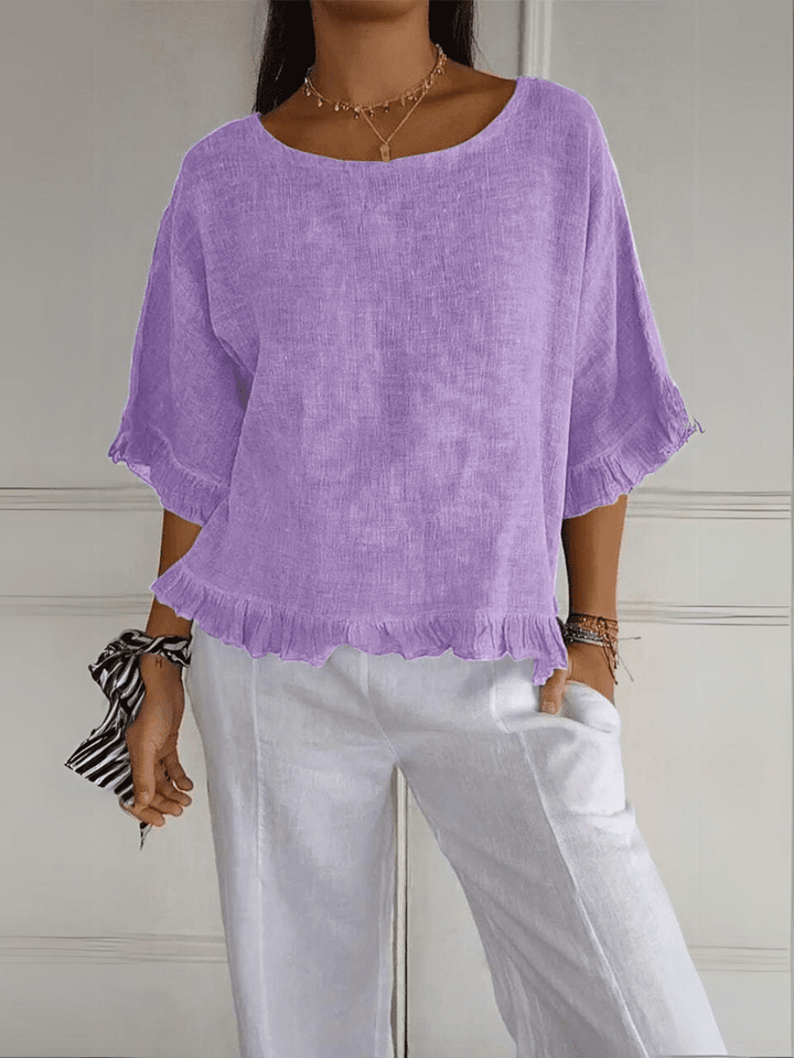 Smart women's ruffle blouse for office wear or elegant evening events. A sophisticated chic top.