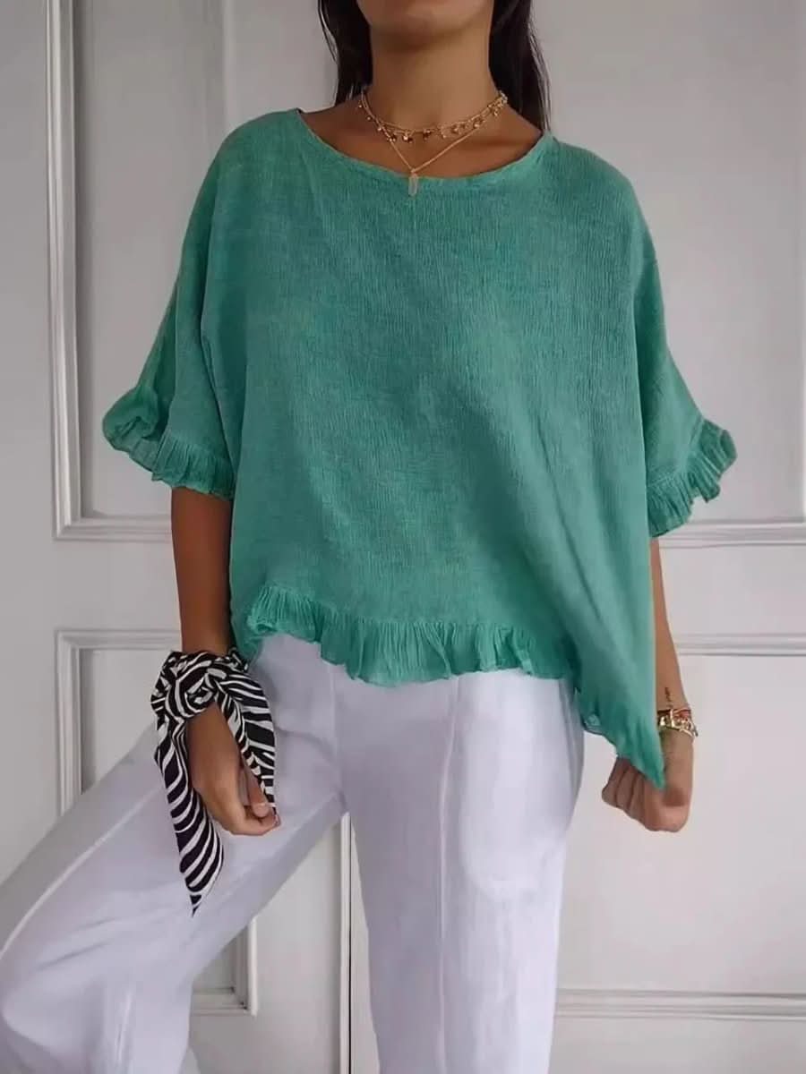 Fashionable women's ruffle top, offering effortless style and comfort. A must-have chic blouse.