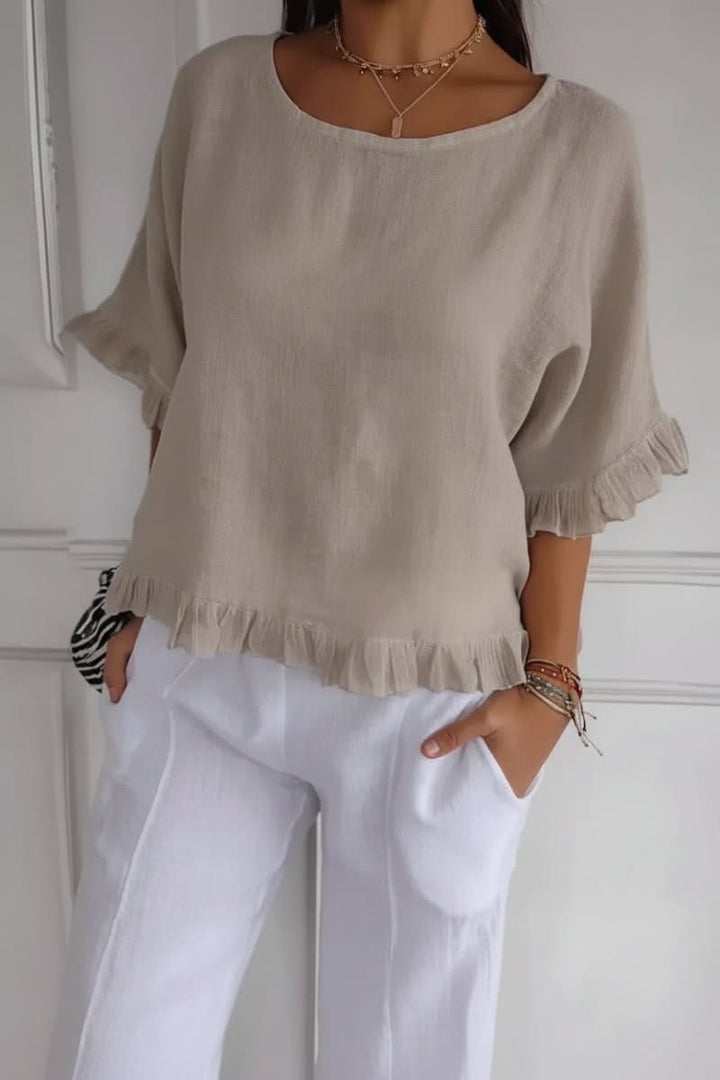 Comfortable women's chic ruffle blouse. An elegant and versatile top for feminine fashion.