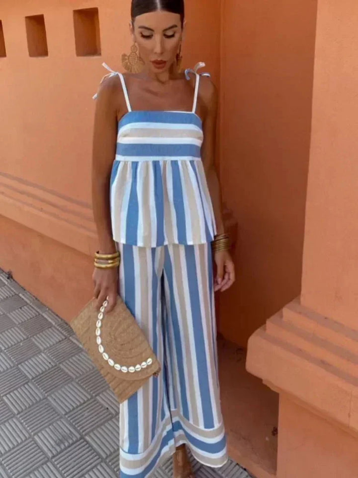 Women's chic striped two-piece outfit set with peplum top and elegant wide-leg trousers for summer events.