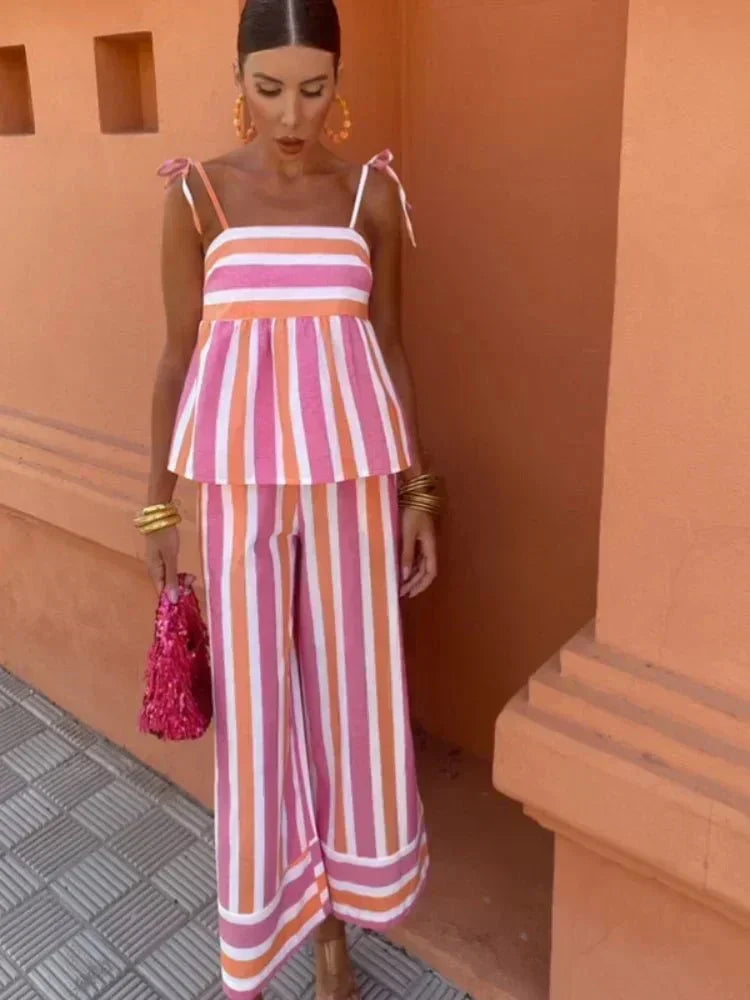 Elegant women's striped wide leg outfit, perfect as a chic wedding guest dress or for a stylish garden party.