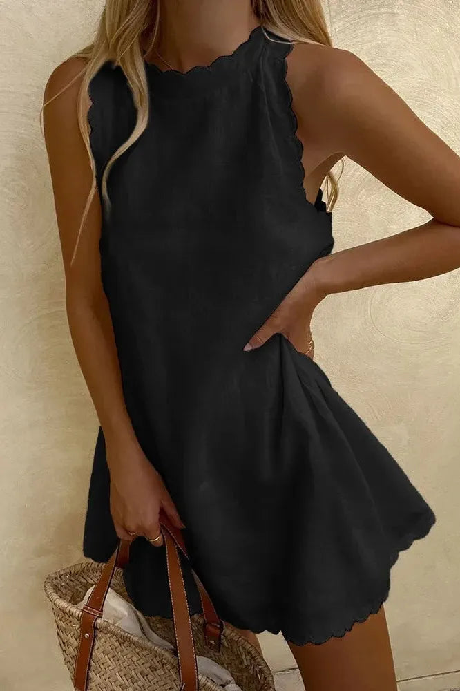 Women's chic tailored mini dress, elegant modern style for party or day wear.