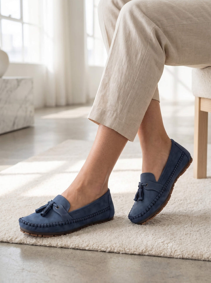 Close-up of classic women's tassel moccasin loafers, highlighting soft material and chic design.