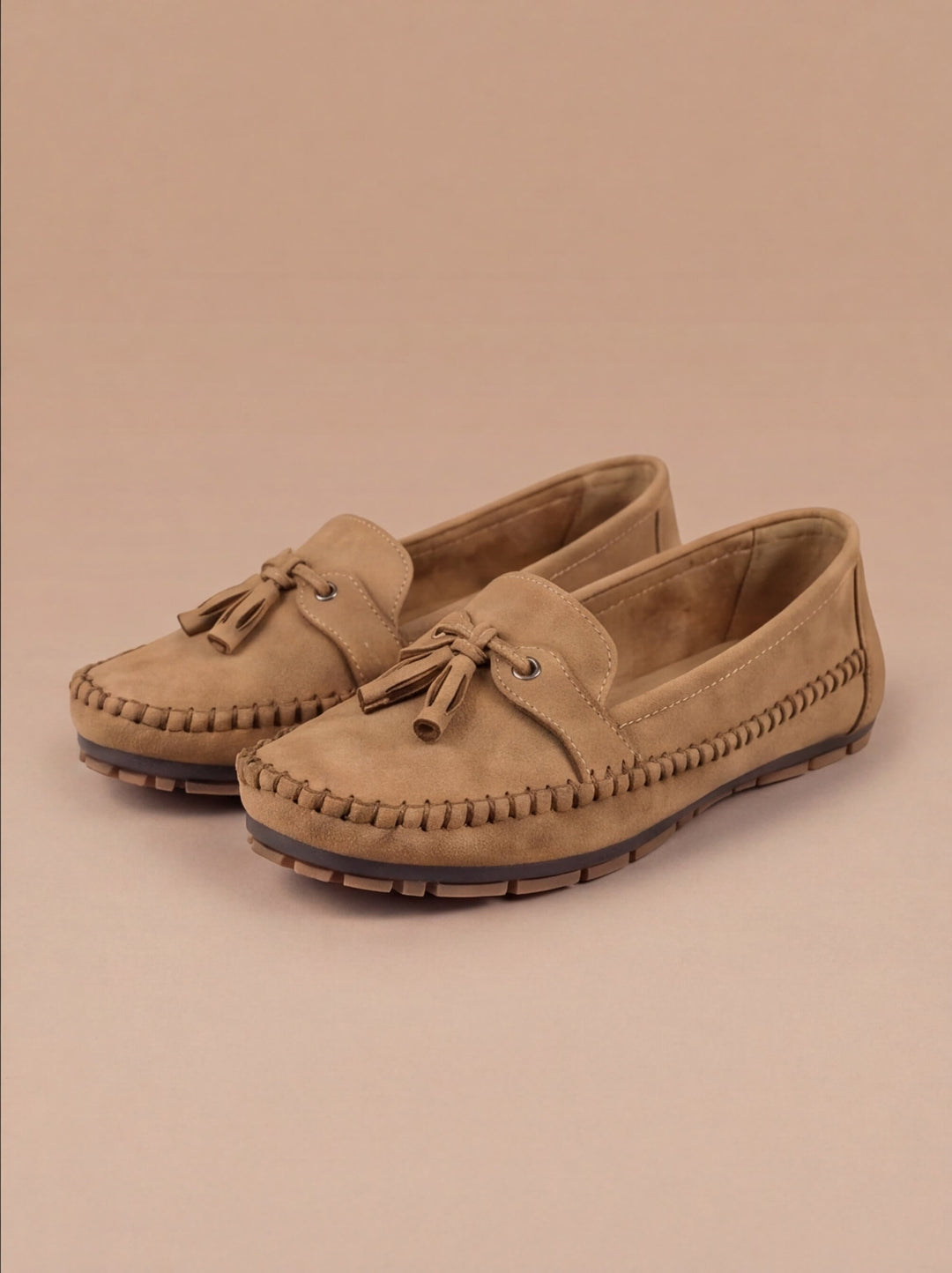 Front view of chic women's tassel moccasin loafers, a classic design for versatile casual elegance.