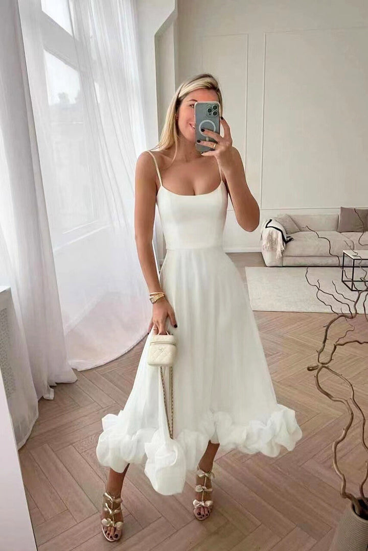 Flowy women's midi twirl dress, ideal for summer weddings or elegant party occasions.