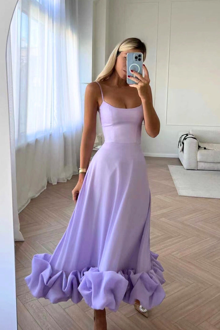 Women's formal midi dress with a beautiful twirl, perfect for a wedding or special event.