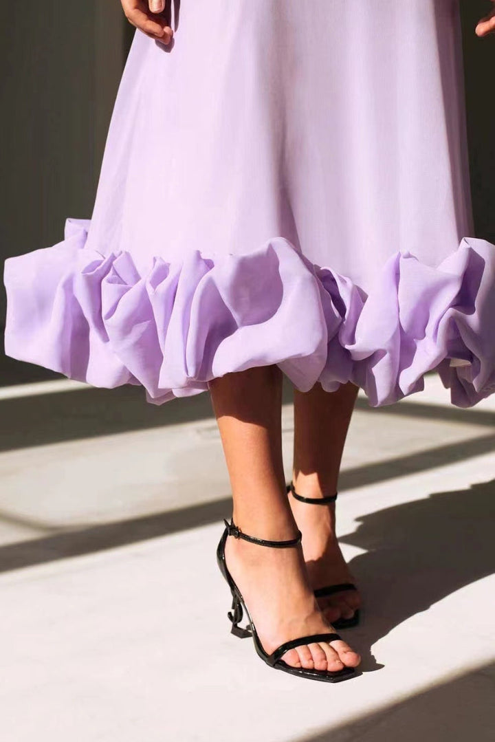Versatile women's occasion wear midi dress, elegant twirl design suitable for weddings.