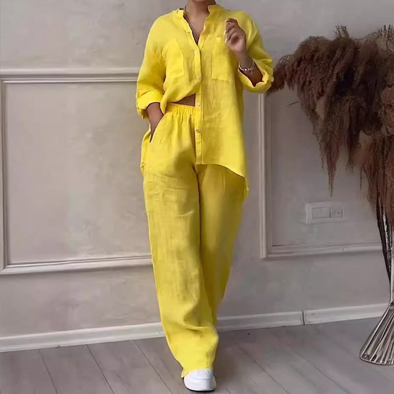 Comfortable women's two-piece casual outfit. Relaxed fit button-down top & wide-leg pants. Versatile summer coordinated set.