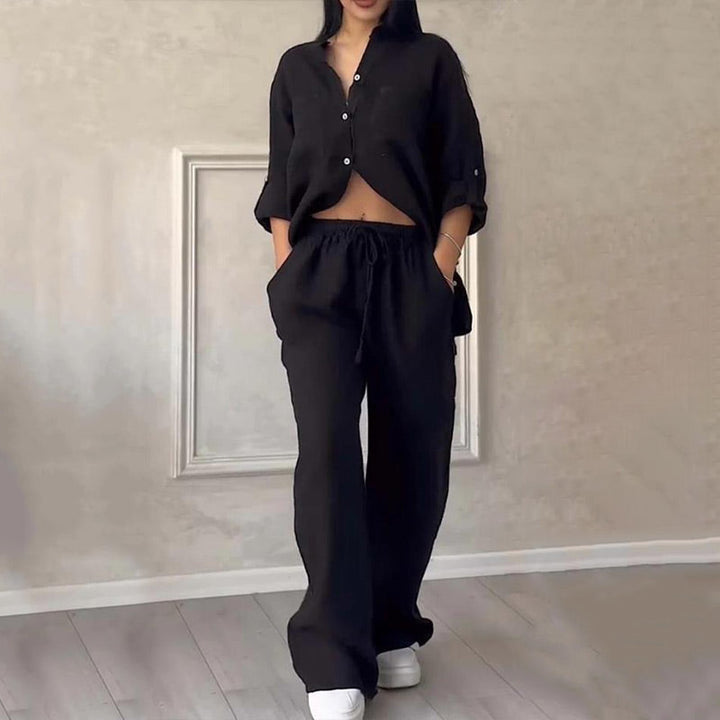 Effortless chic women's two-piece set: a relaxed button-down top & wide-leg pants. Perfect for summer style.