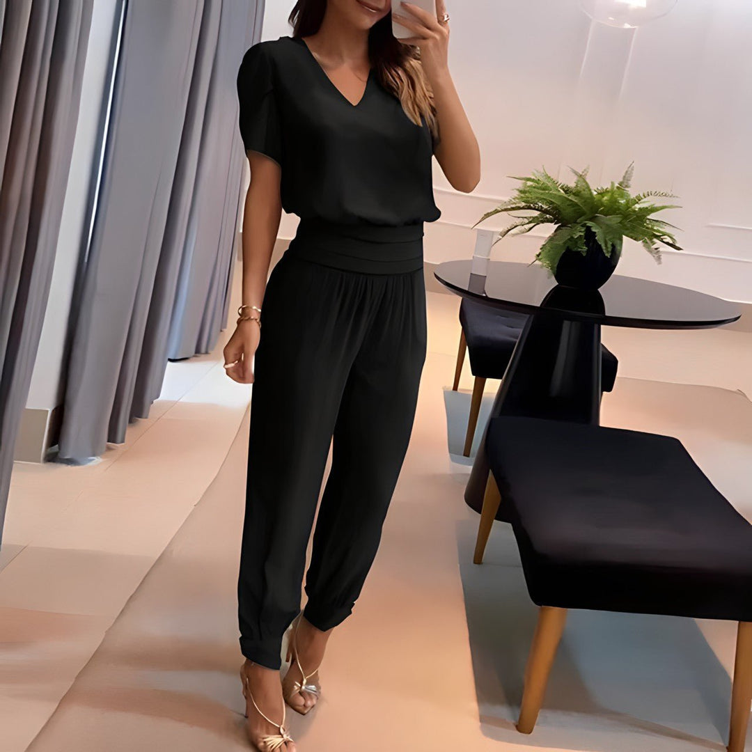 Effortless women's matching two-piece set with a chic top & comfortable pants. Ideal for modern casual style.
