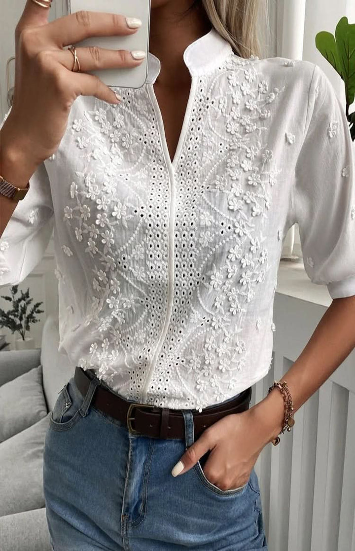Stylish women's V-neck top, short sleeve, suitable for elegant office wear or comfortable everyday fashion.