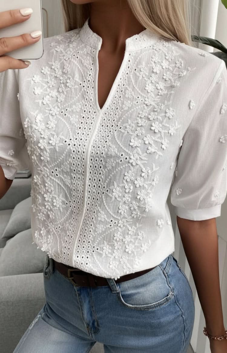 Flattering women's V-neck top with short sleeves, an elegant and versatile piece for any casual or professional setting.