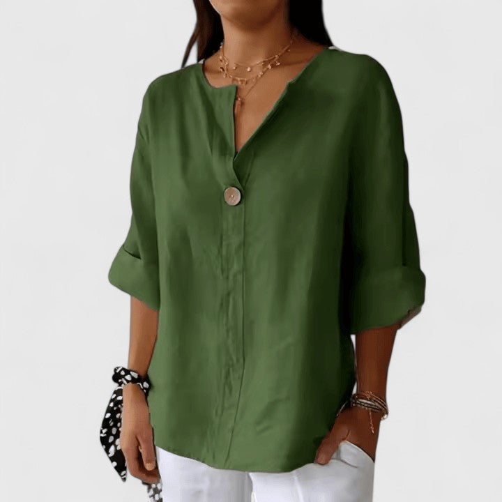 Close-up of a stylish women's V-neck knot blouse. Loose-fit design, ideal for comfortable summer fashion.