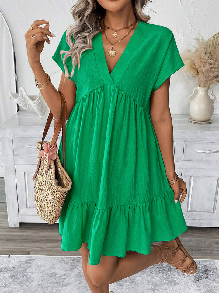 Women's chic V-neck summer mini dress with a stylish ruffle hem, perfect for casual outings or holidays.