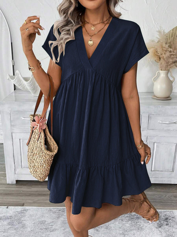 Stylish sleeveless women's mini dress featuring a flattering V-neckline and playful ruffle hem, ideal for summer.