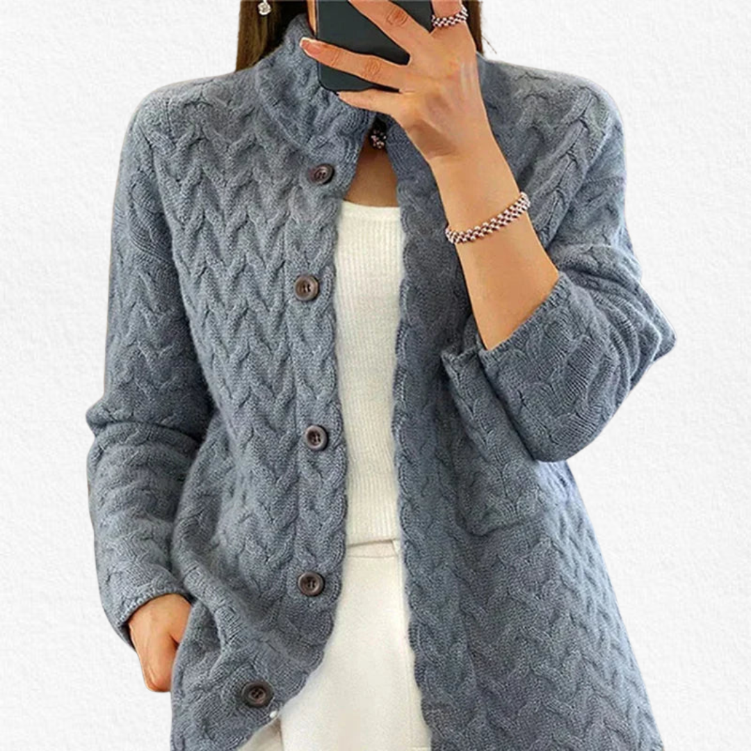Cozy women's chunky cable knit cardigan with button closure. A warm, relaxed fit sweater, essential for cold weather.