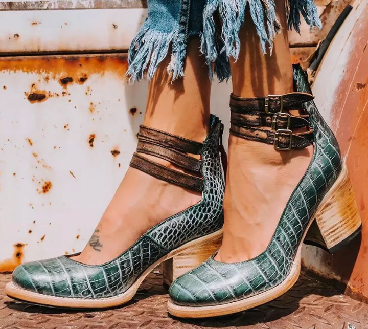 Women's pumps with a comfortable round toe, secure ankle strap, and stable block heel for all-day wear.
