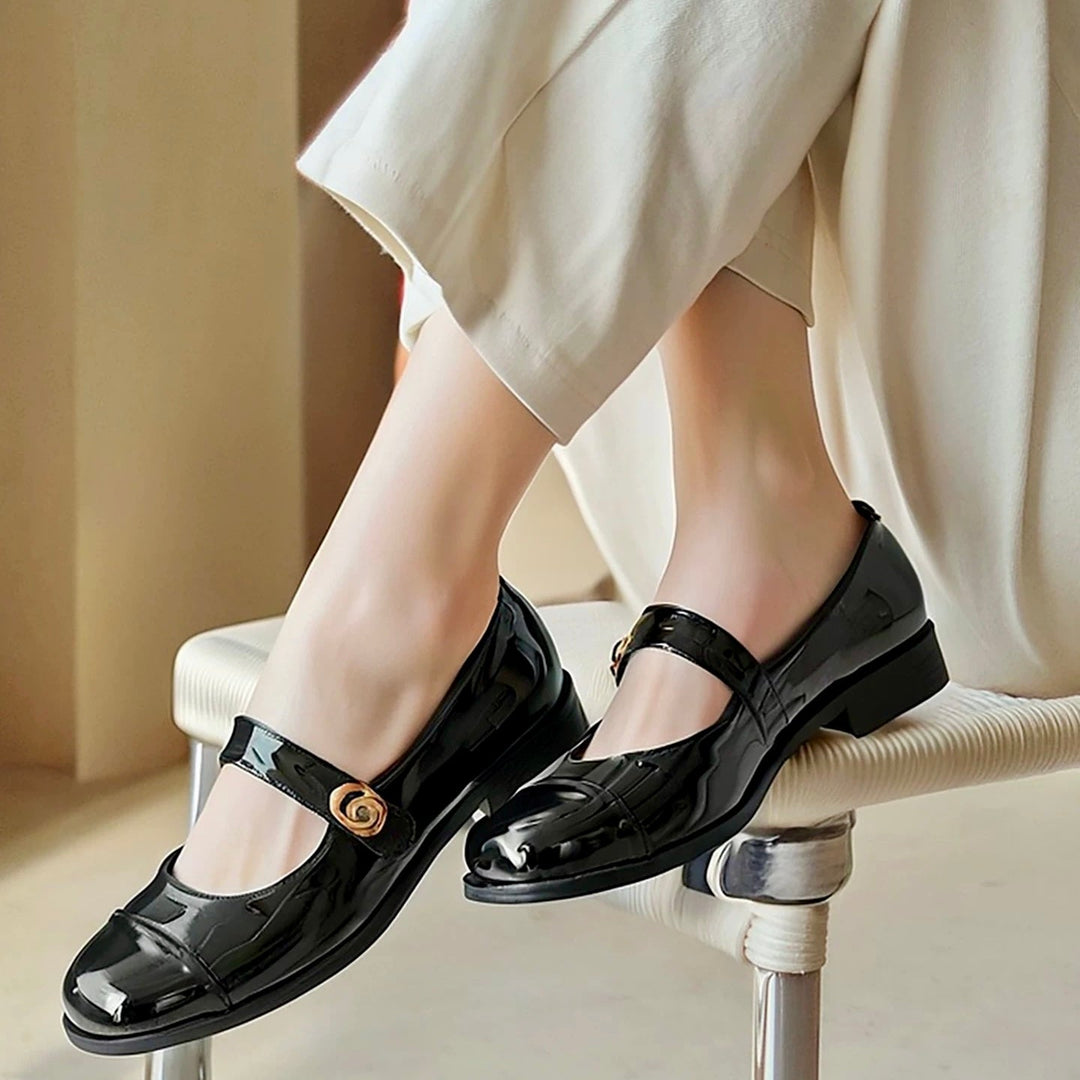Elegant black Mary Jane flats for women, designed with a wide toe box & orthopedic arch support.