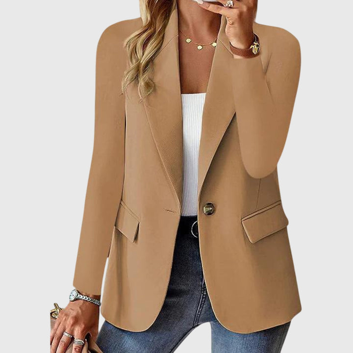 Crisp white women's single-breasted blazer, classic notch lapel. Tailored workwear jacket, ideal for professional fashion.