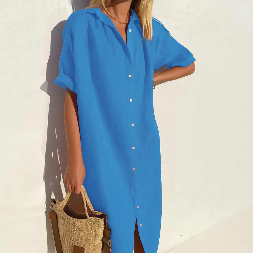 Stylish women's short sleeve midi shirt dress, button-down, collared, relaxed fit for comfortable everyday wear.
