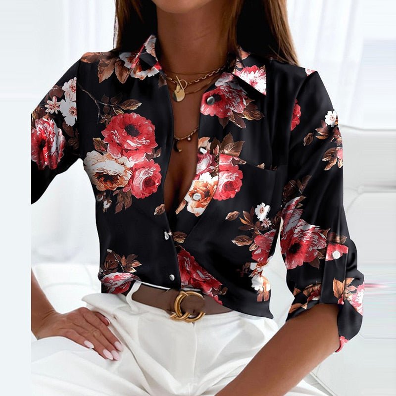 Close-up of the classic collar and button details on a timeless women's long sleeve blouse.
