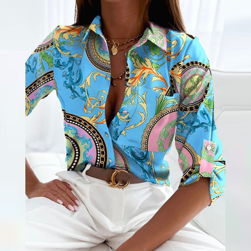Women's fashion blouse with a sharp collar and neat button placket, designed for a sleek and polished appearance.