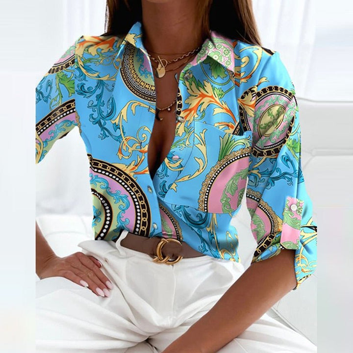 Women's fashion blouse with a sharp collar and neat button placket, designed for a sleek and polished appearance.