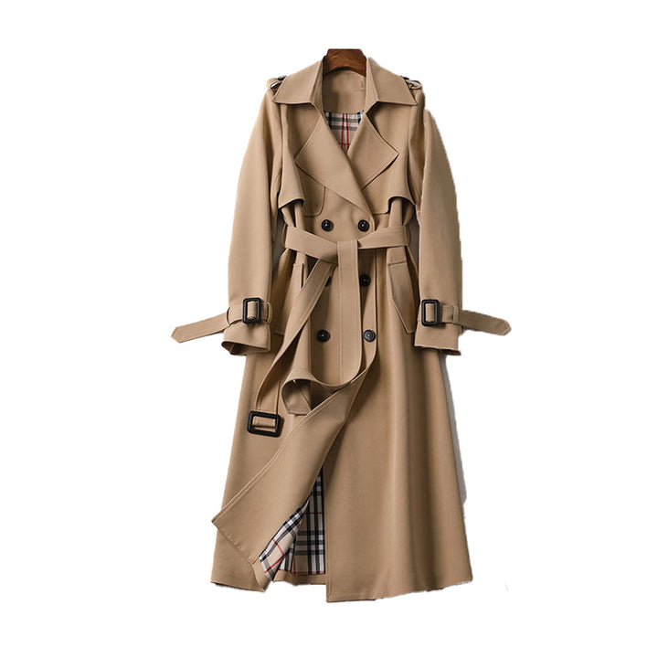 Women's classic double-breasted trench coat in a neutral color, perfect for autumn outerwear.