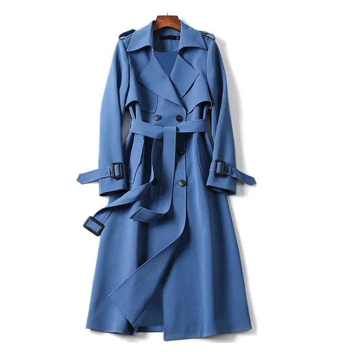 Women's classic double-breasted trench coat with tie-waist. Elegant long outerwear for versatile office & casual wear.