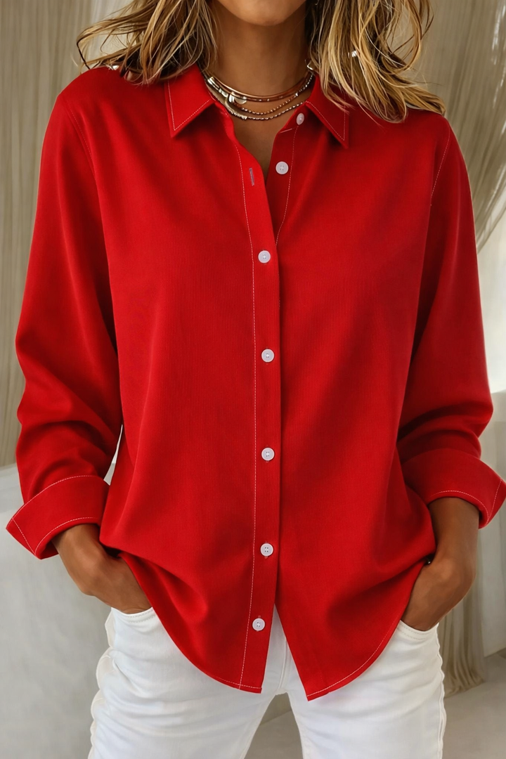 Women's long sleeve button-up blouse with a comfortable relaxed fit and timeless classic design.