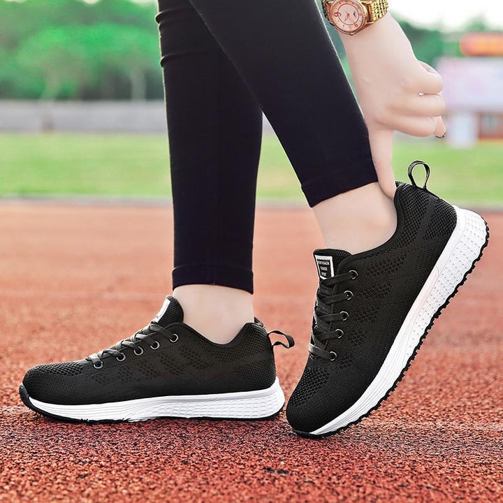 Women's arch support shoes, white, with a classic walking shoe style for lasting comfort.