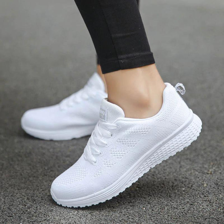 Rear view of women's support shoes for comfortable everyday walking and stability.