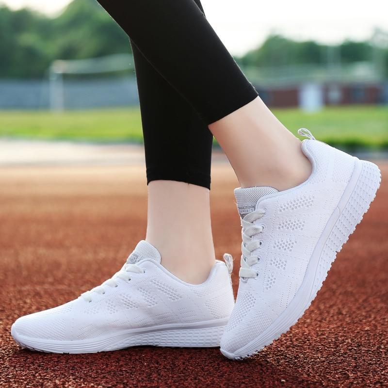 Women's lace-up walking shoes, grey, with advanced cushioning for superior comfort.
