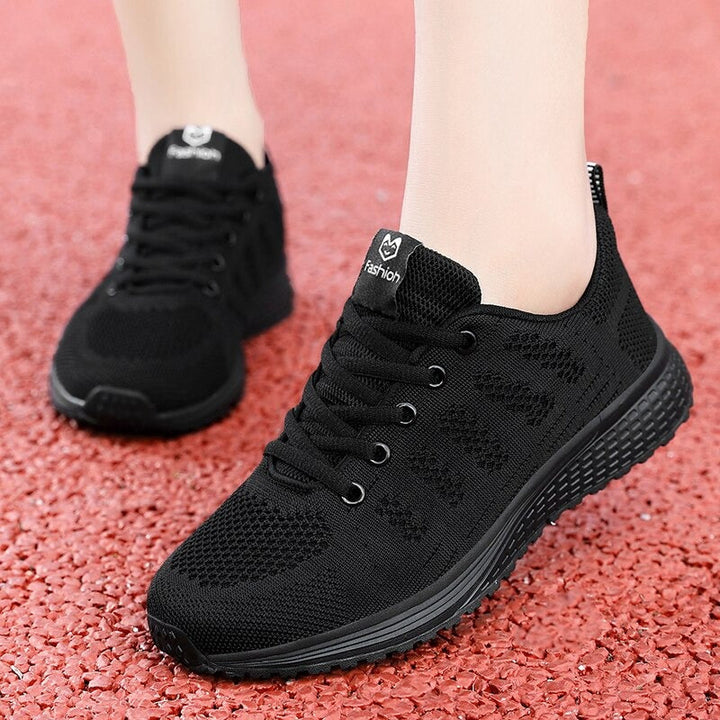Classic lace-up women's walking shoes, side view, comfort-focused with arch support.