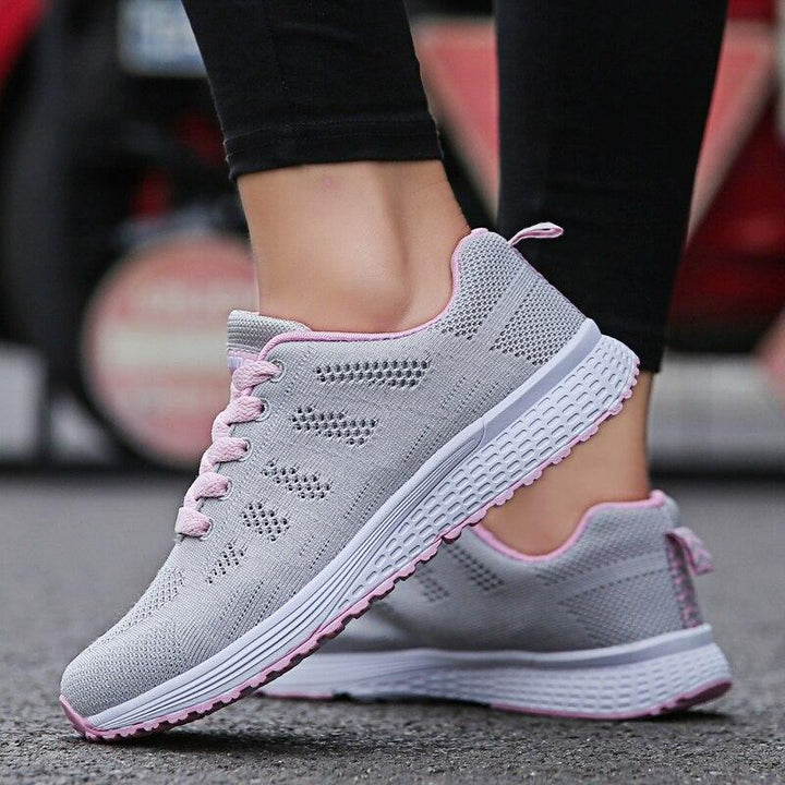 Women's orthopedic walking shoes, grey, featuring arch support and a breathable design for comfort.