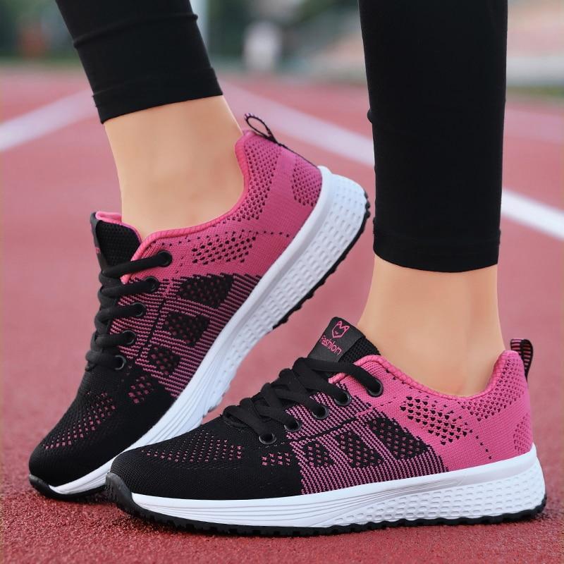 Detail shot of breathable mesh on women's comfort walking shoes, ideal for long walks.