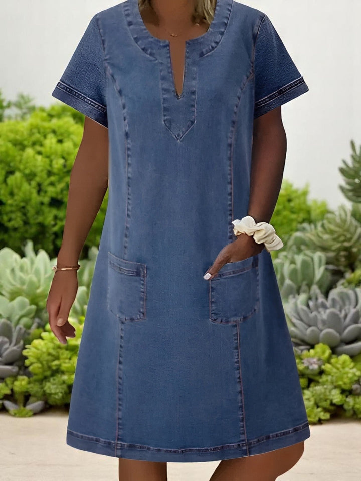 Women's classic shift dress with practical pockets. Perfect for versatile everyday wear & comfortable style.