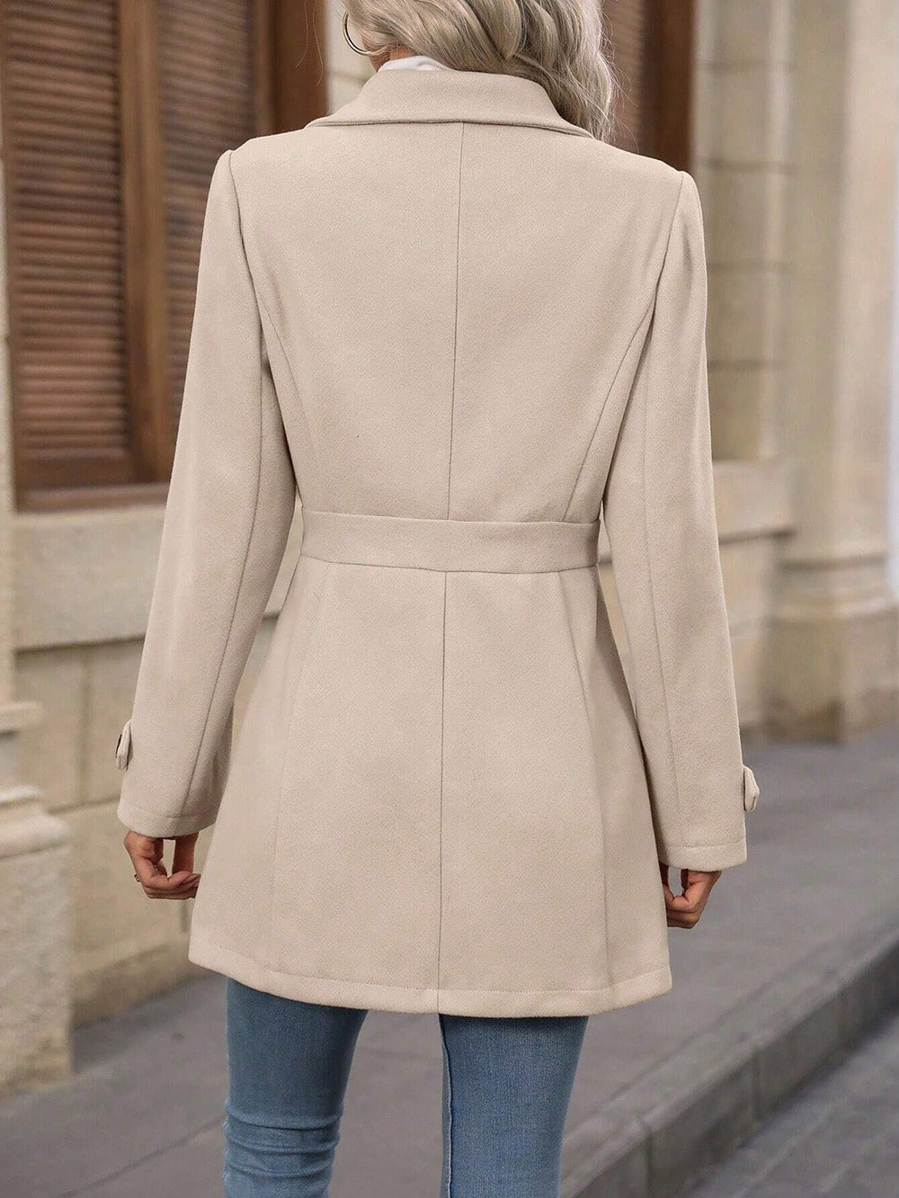 Elegant women's trench coat, a versatile long jacket with belted waist for professional office wear.