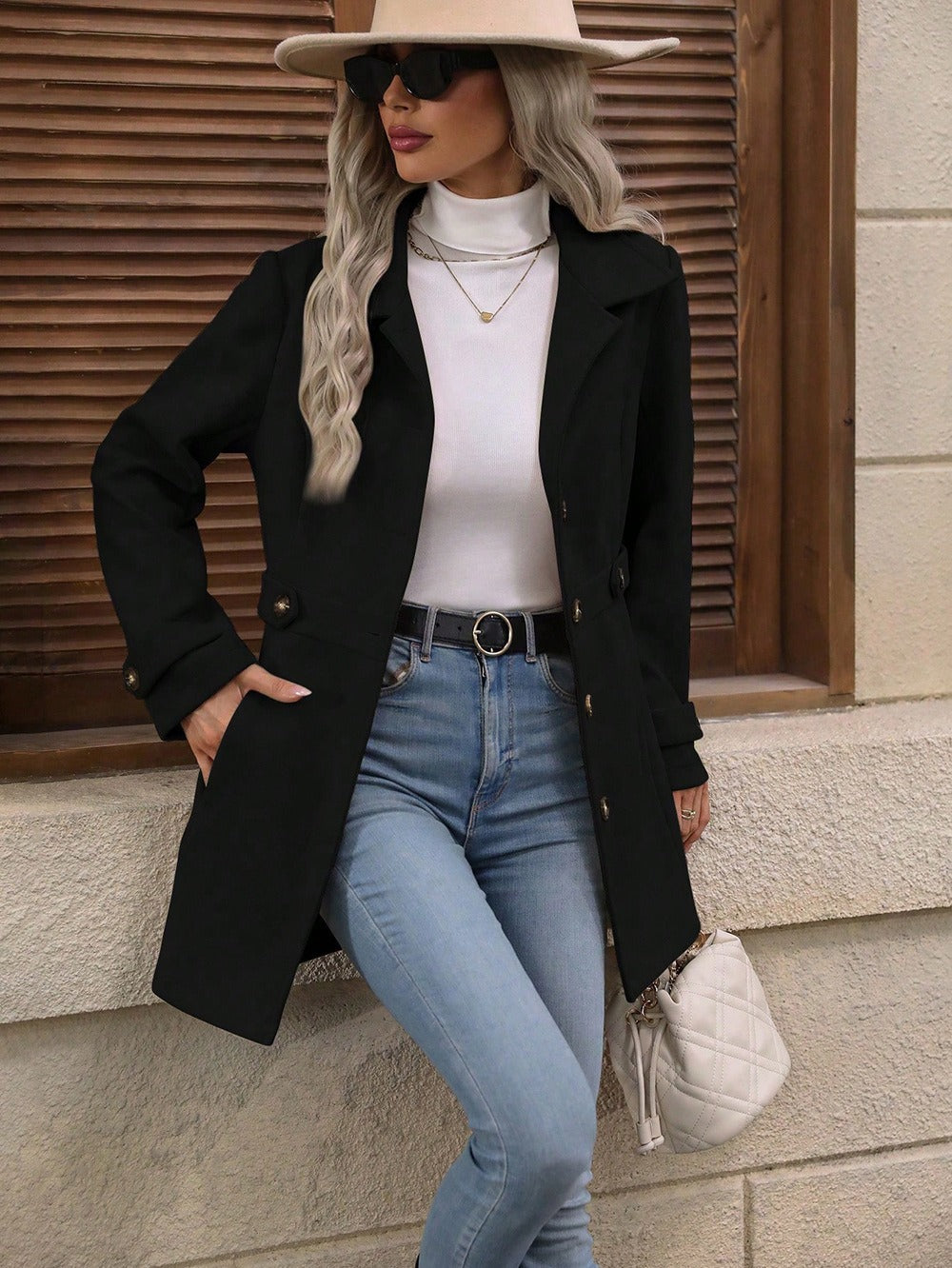 Stylish women's trench coat with adjustable belt and a sophisticated notch collar, great for office wear.