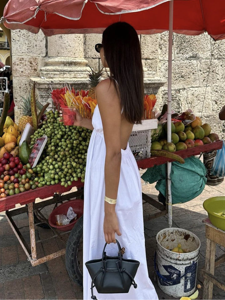 Sleeveless Coastal Cowgirl open back maxi dress. Chic V-neck summer vacation outfit for women.