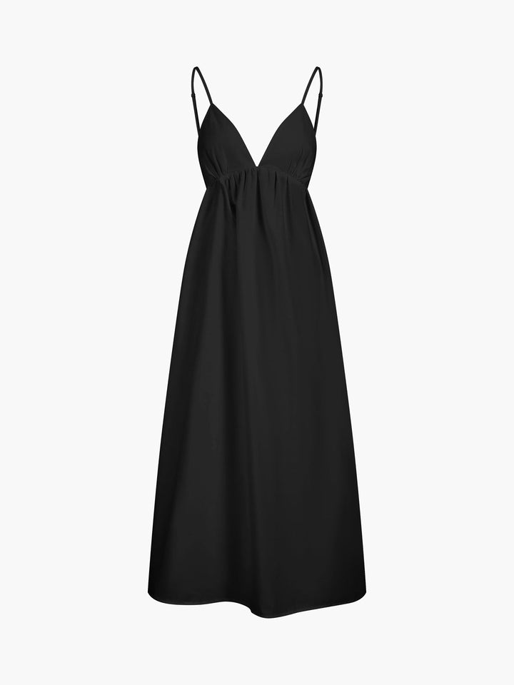 Solid color women's open back maxi dress. Flowing, sleeveless V-neck, comfortable summer beach wear.