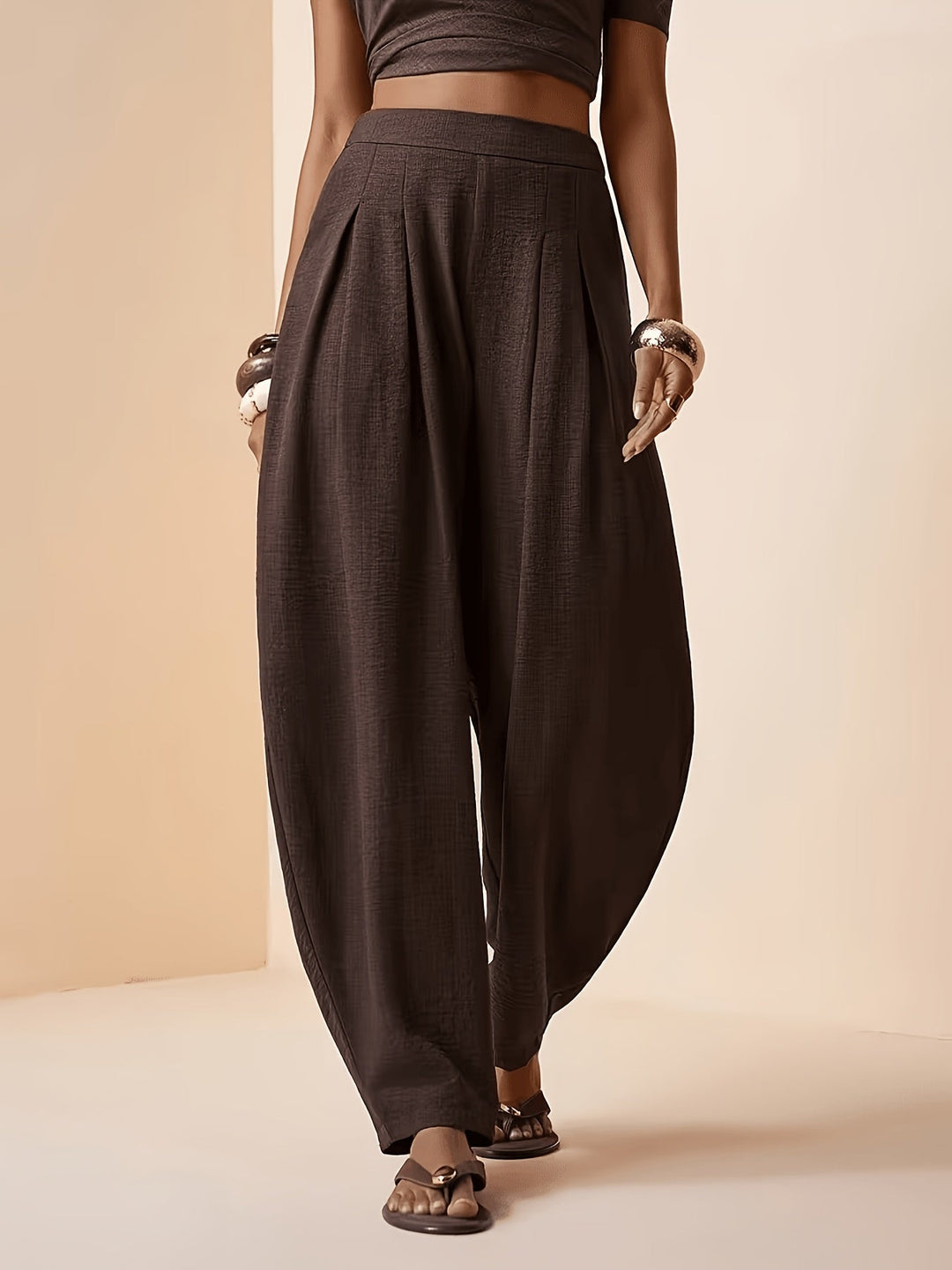 Women's coffee brown high-waist harem pants with pleats & tapered ankle. Comfortable casual & travel wear.