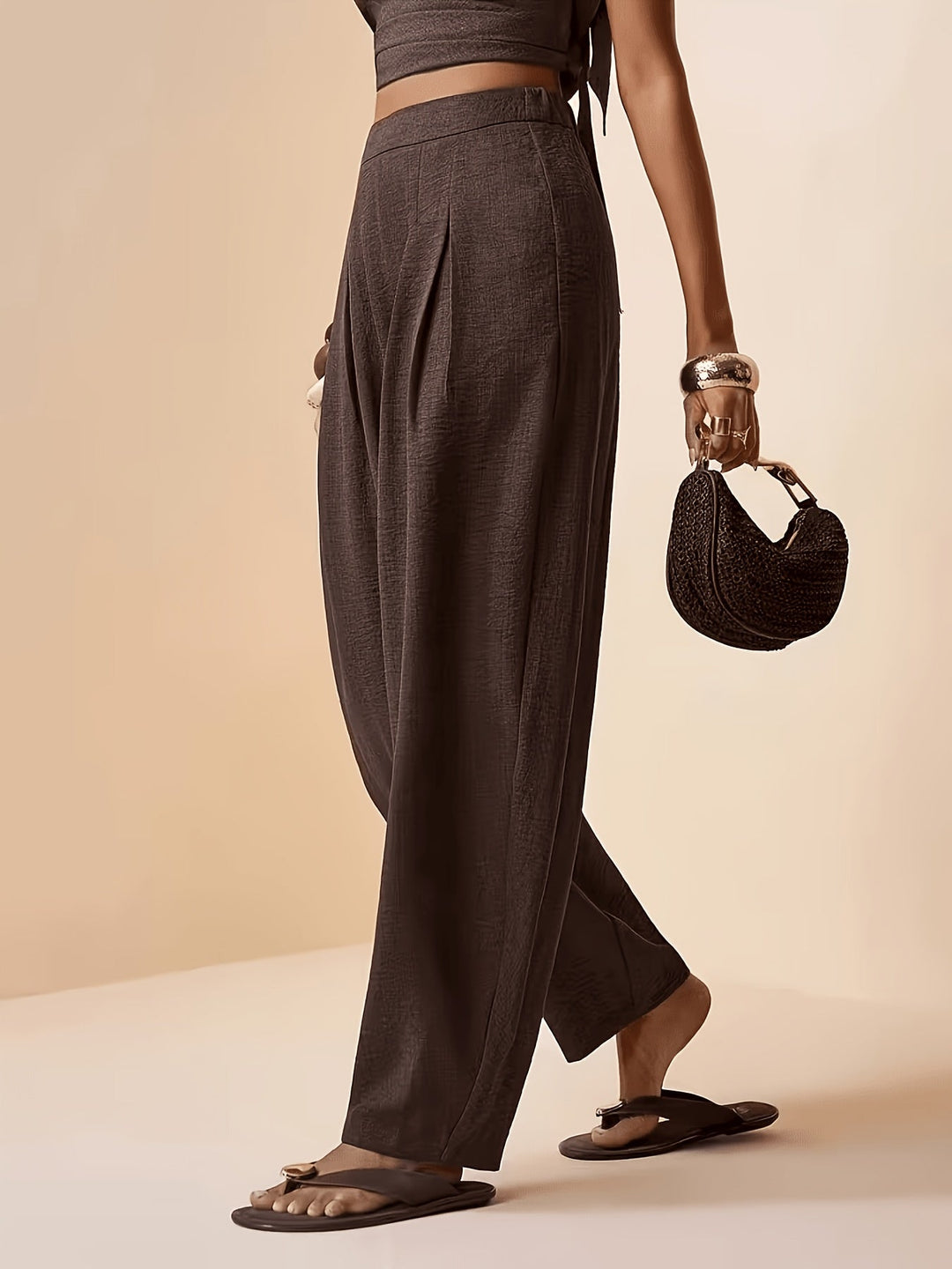 Comfortable women's coffee brown high-waist pleated harem pants, featuring a stylish tapered ankle design.