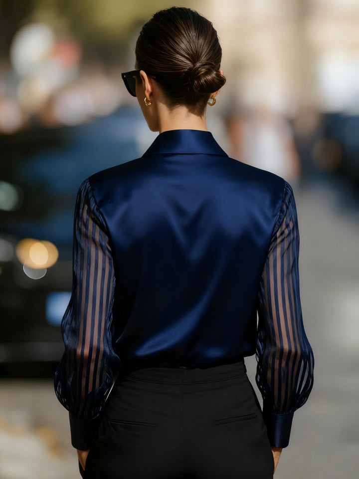 Women's elegant collared button-up work blouse with sophisticated sheer long sleeves for office style.