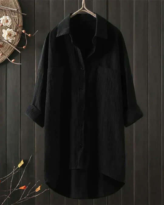 Comfortable women's oversized longline blouse with roll-tab sleeves. Versatile casual top for travel & summer fashion.