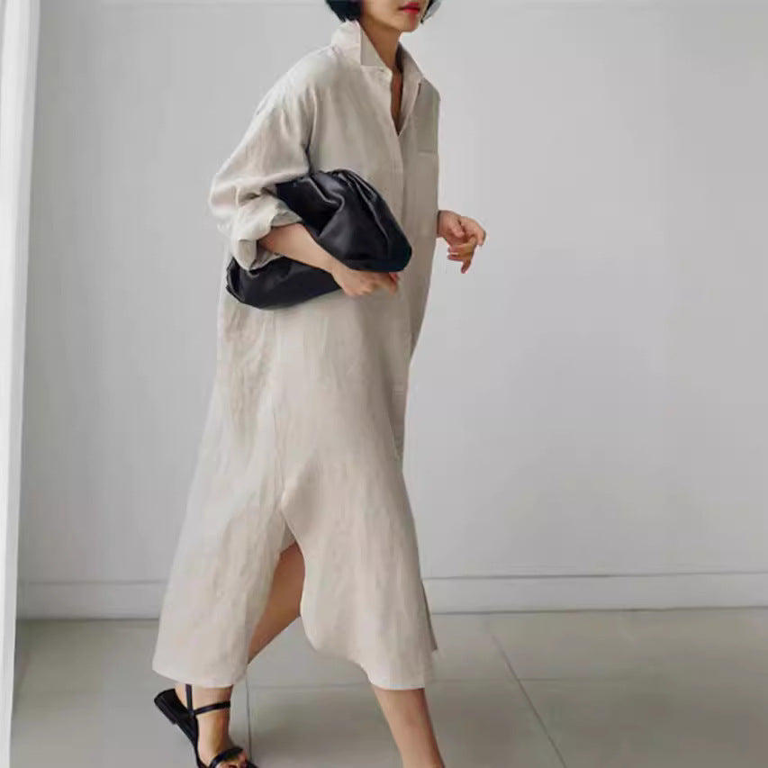Stylish women's midi shirt dress with a collared neckline, roll-tab sleeves, and longline cut.